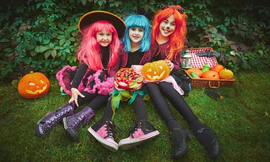 Three girls dressed up for Halloween