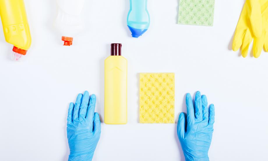 cleaning-supplies-with-person-wearing-gloves.jpg